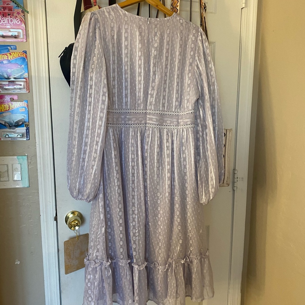 Purple midi dress
Small but fits a medium